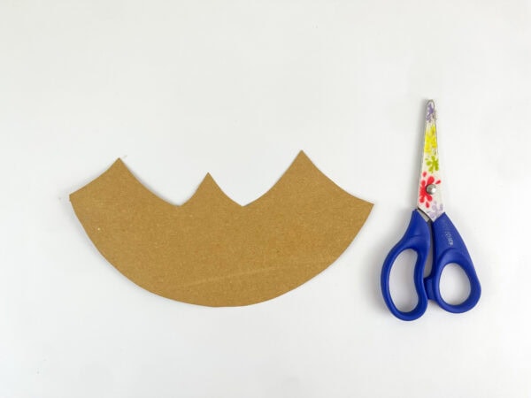 Cut desert landscape piece and scissors