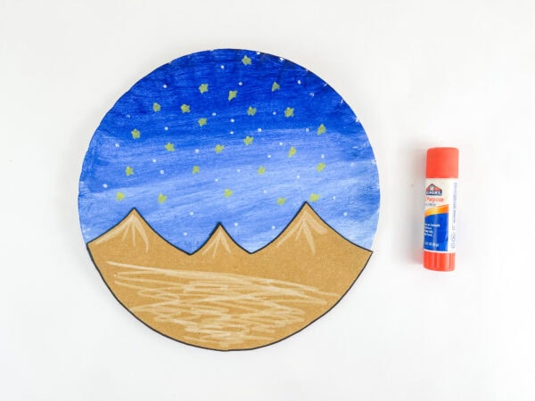 Starry night desert scene on paper plate
