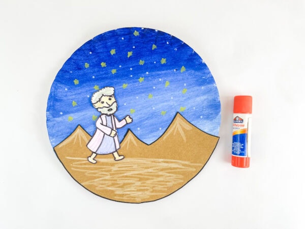 Abraham figure glued onto desert scene