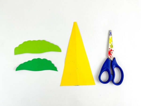 Green hills and yellow paper cutout pieces