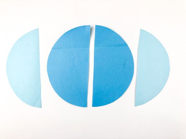 A blue circle cut in half with light blue half-circles on either side.