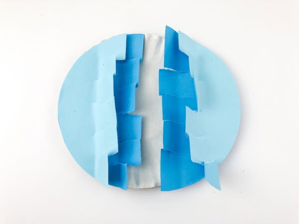 Two jagged-edged half-circles positioned to form a circle with a white gap in the center.