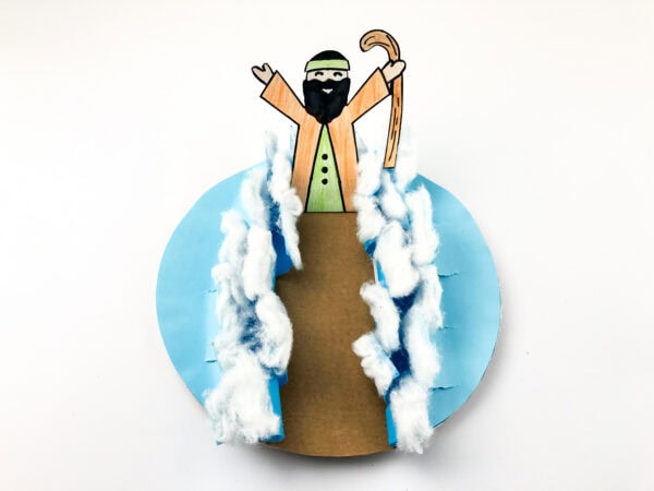 The colored figure standing at the top of the brown path between the cotton waves.