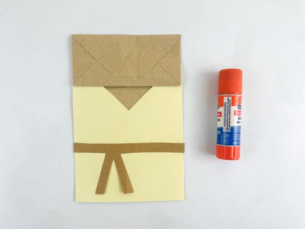 Folded paper bag with robe attached