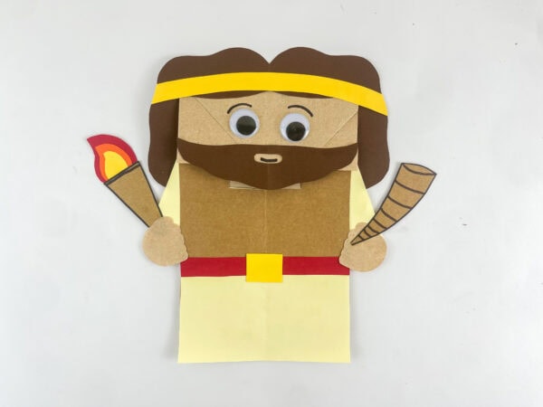 completed Gideon Bible craft paper bag puppet with torch horn googly eyes and smile kids Sunday school craft

