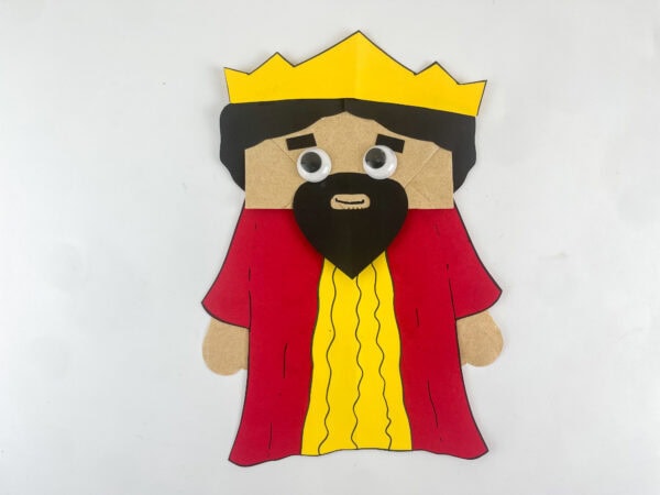 completed King Solomon Bible craft paper bag puppet with crown robe beard and googly eyes kids Sunday school craft
