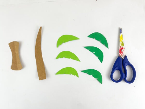 Deborah craft scroll and palm tree pieces scroll trunk and green leaf fronds cut out before assembly