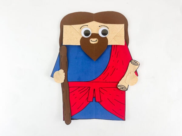 completed Ezekiel Bible craft paper bag puppet with staff scroll brown hair beard blue robe red sash kids Sunday school craft