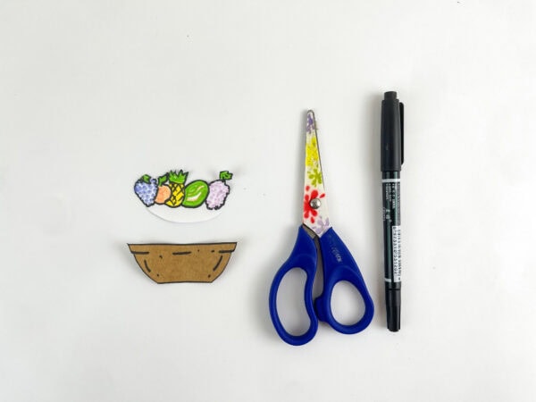 Basket printable with scissors and black marker.