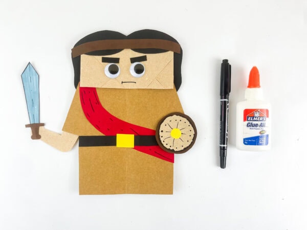 Completed Joshua puppet with facial features and accessories.