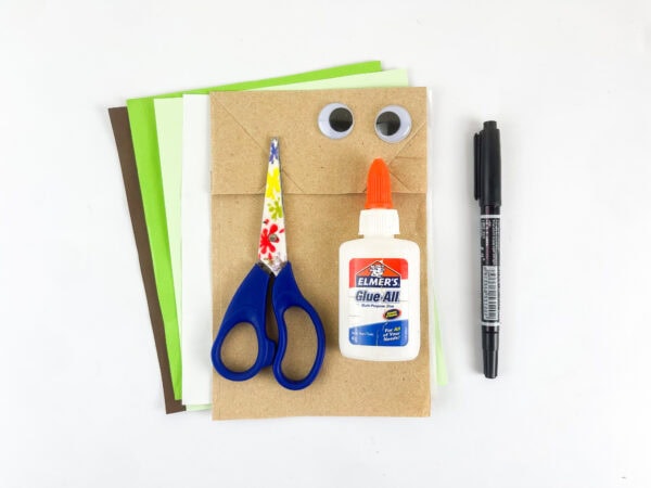 Supplies for making an Isaiah paper bag puppet
