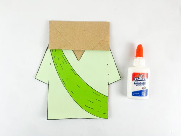 Attaching Isaiah’s robe to a brown paper bag
