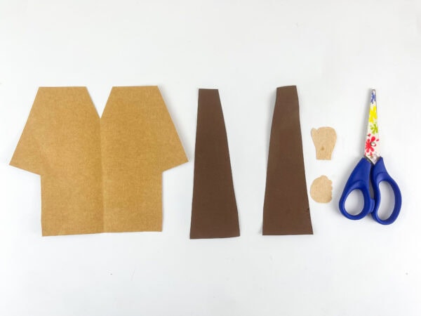 Cut paper pieces for the Hosea puppet body.