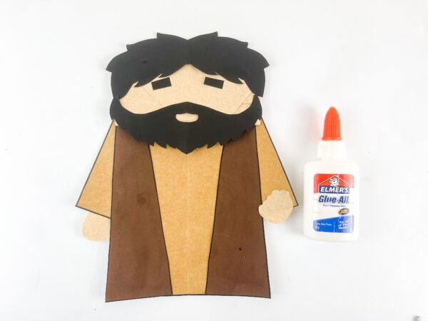Attaching the hair and beard to the Hosea puppet.