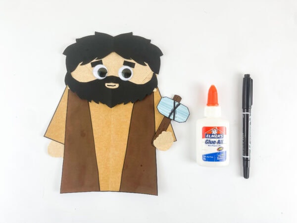 Adding googly eyes to the Hosea puppet.