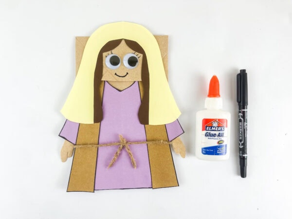 Completed puppet beside the supplies
