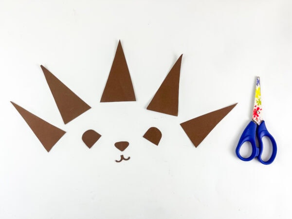 Brown paper hedgehog spines ears and nose cut from template