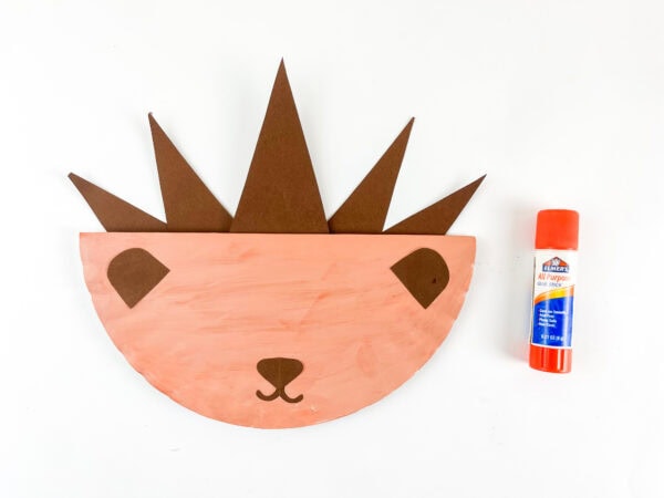 Paper plate hedgehog with ears nose and mouth attached