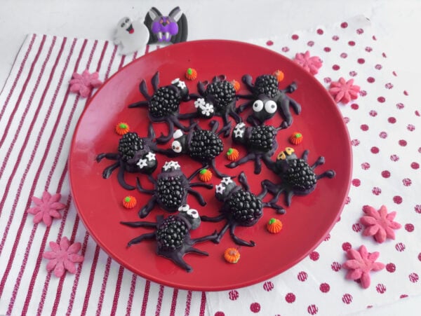 Finished blackberry spiders with candy eyes and pumpkins.