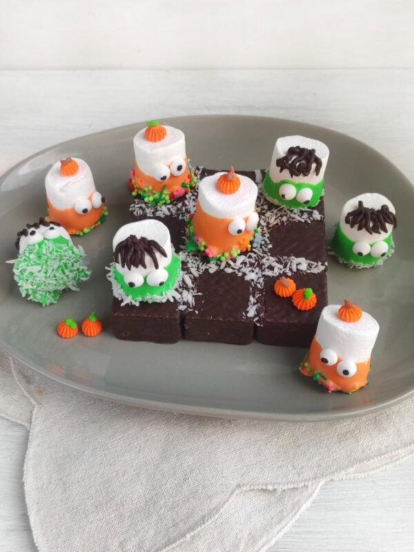Finished Halloween tic tac toe dessert arranged on a serving platter.