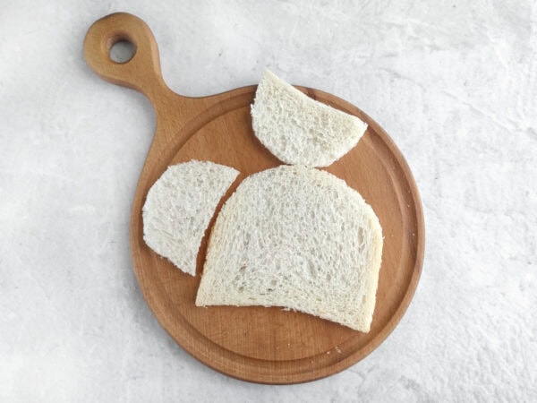 Crustless bread cut into rounded turtle shell and head shapes
