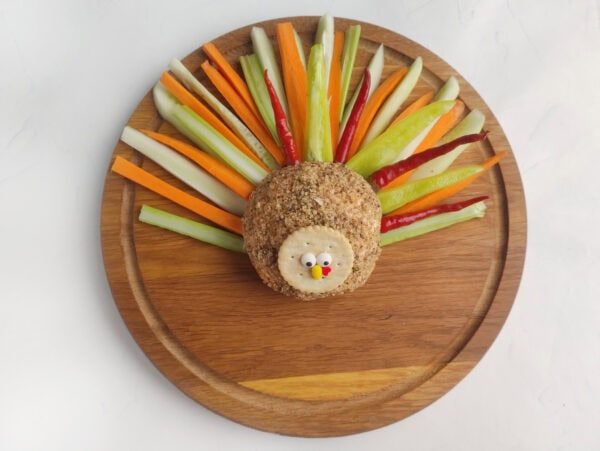 Cucumber, carrot, celery, bell pepper, and pickled peppers arranged as turkey tail feathers