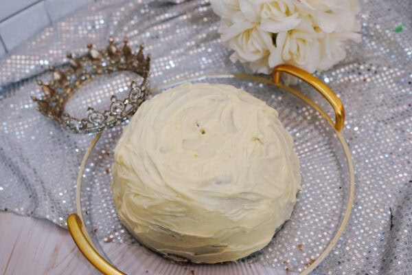 Dome-shaped Belle dress cake covered with yellow frosting