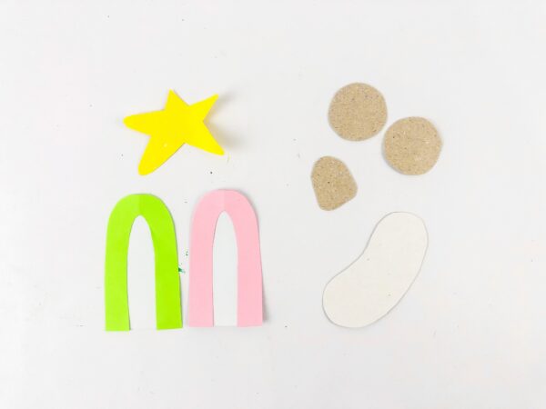 Nativity craft cutouts including robes, star, baby, and faces.