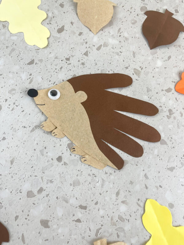 Angled hedgehog handprint craft made from brown construction paper