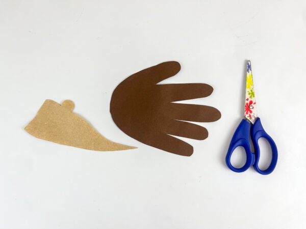 Cut paper pieces for a handprint hedgehog craft