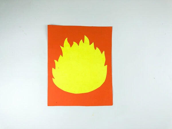 Yellow flame shape on orange paper
