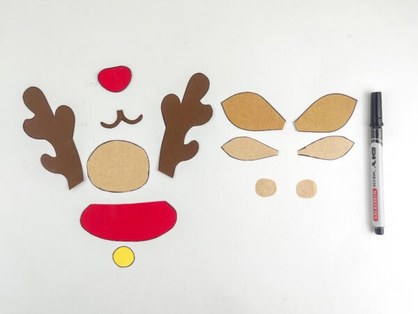 Reindeer craft pieces arranged before assembly