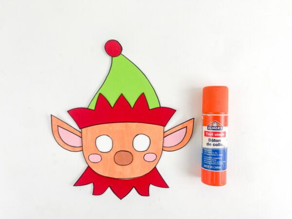 Elf face with green hat and red collar attached.