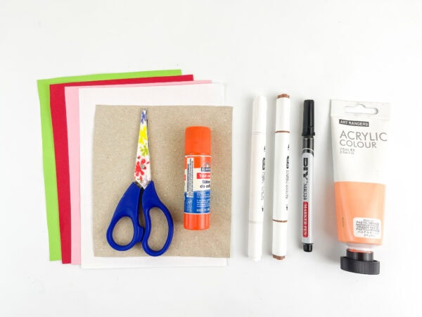 Supplies for the paper elf with moving eyes.